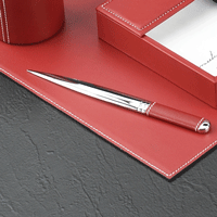 Library set with chrome-plated brass letter opener and scissors in a red leather case